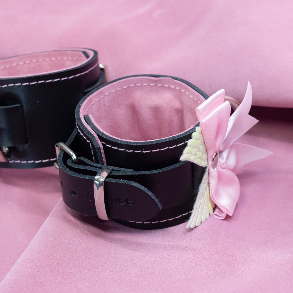 Bondage Cuffs - Black Leather lined with Pretty Baby Pink Suede with Pink Bow and Angel Wings