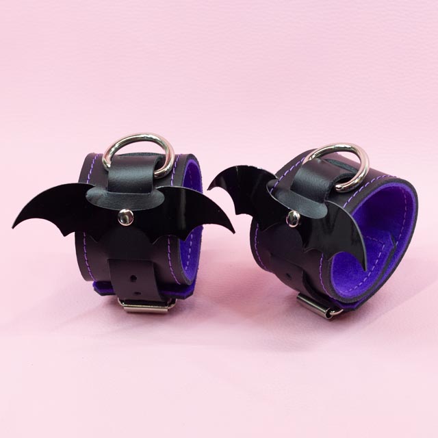 Leather Wrist Cuffs with shiny bats and Violet Lining