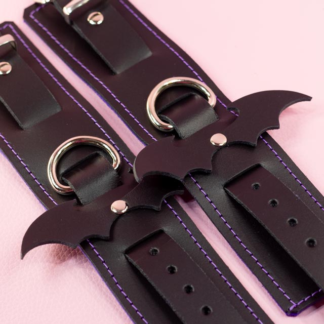 Leather Wrist Cuffs with matte black bats and Violet Lining