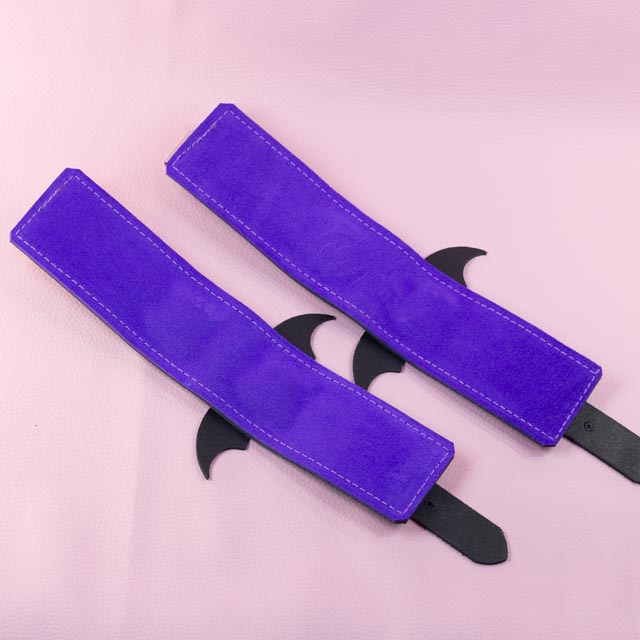 Leather Wrist Cuffs with matte black bats and Violet Lining