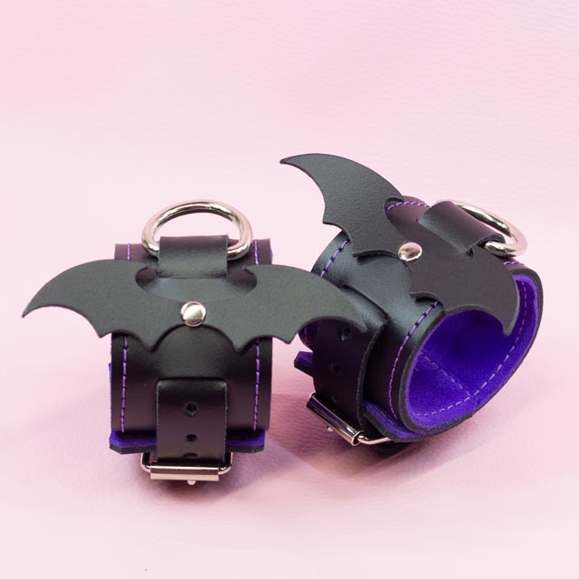 Leather Wrist Cuffs with matte black bats and Violet Lining