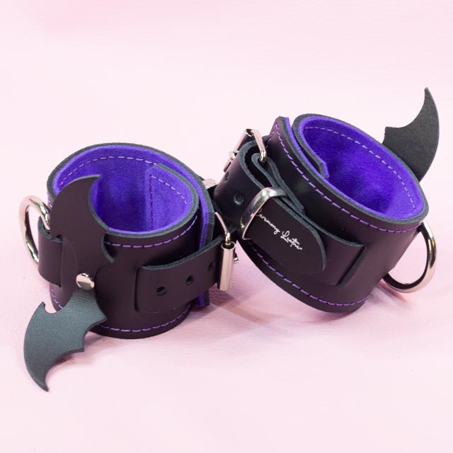 Leather Wrist Cuffs with matte black bats and Violet Lining